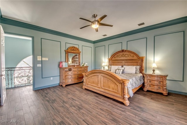 bedroom with ornamental molding, dark hardwood / wood-style floors, and ceiling fan