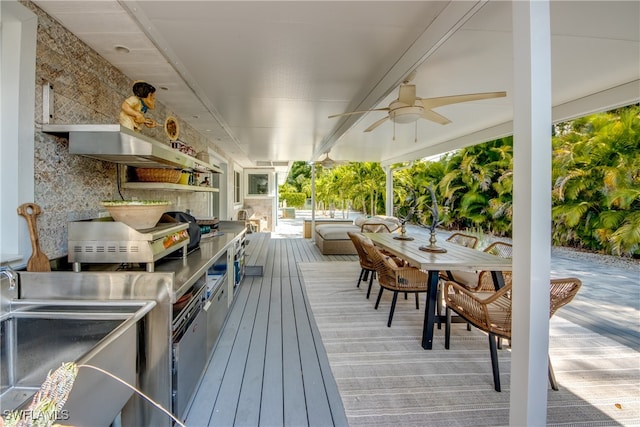 wooden terrace featuring ceiling fan