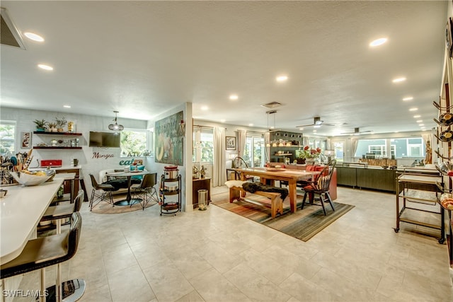 dining area with ceiling fan