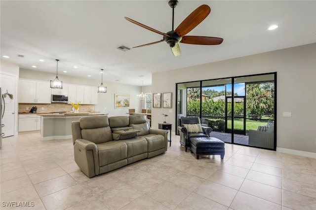 tiled living room with ceiling fan