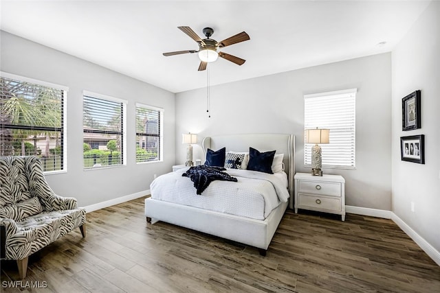 bedroom featuring ceiling fan and dark wood-type flooring