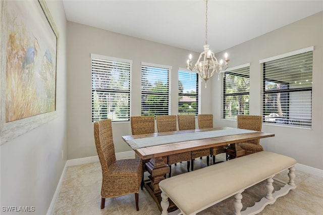 dining space featuring a notable chandelier