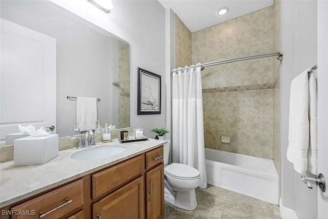 full bathroom featuring shower / bath combo with shower curtain, vanity, and toilet