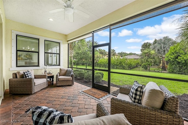 sunroom with ceiling fan