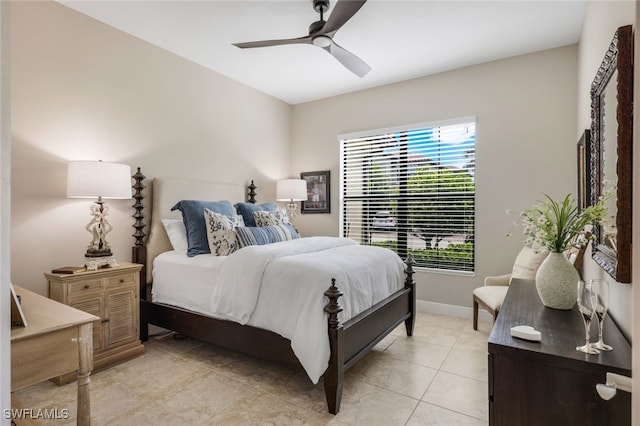 tiled bedroom featuring ceiling fan