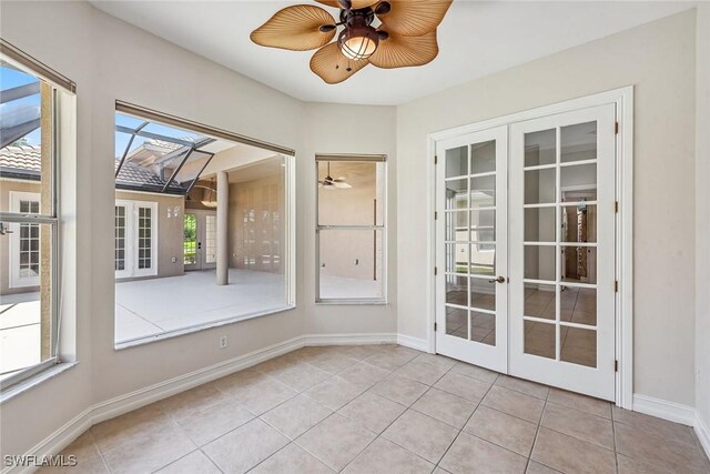 interior space with ceiling fan and french doors