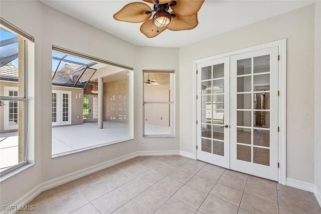 interior space with french doors and ceiling fan