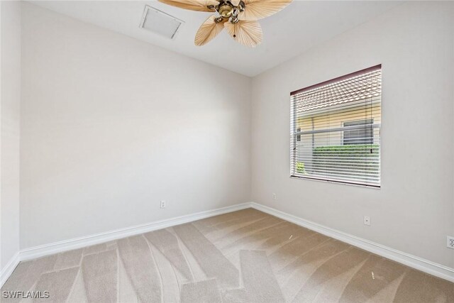 carpeted empty room with ceiling fan