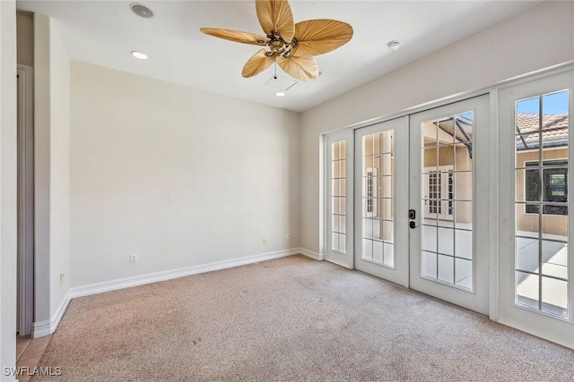 carpeted empty room featuring recessed lighting, french doors, a ceiling fan, and baseboards