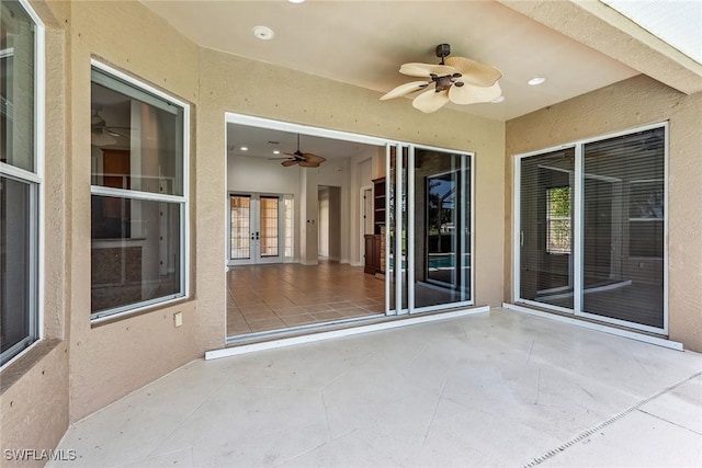 view of patio featuring french doors and ceiling fan