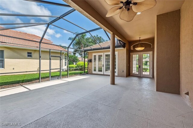 view of patio / terrace with ceiling fan, french doors, and a lanai