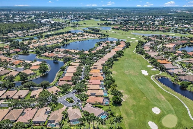 birds eye view of property featuring view of golf course and a residential view