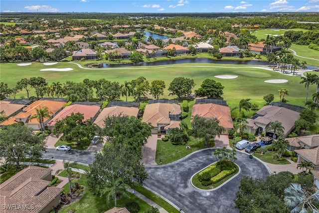 birds eye view of property with a residential view, golf course view, and a water view