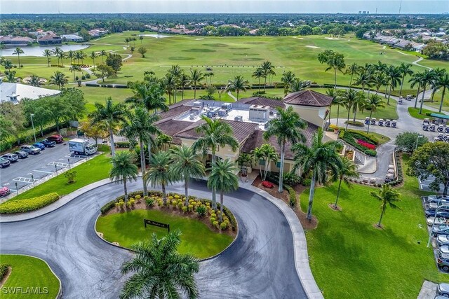 aerial view with view of golf course and a water view