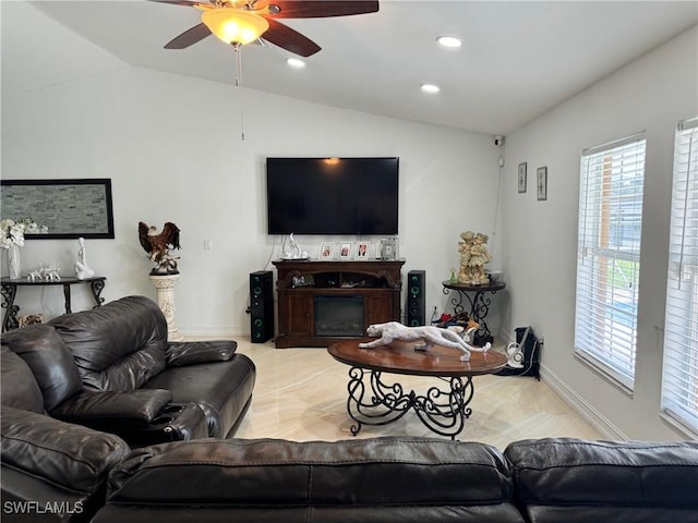 living room with lofted ceiling and ceiling fan