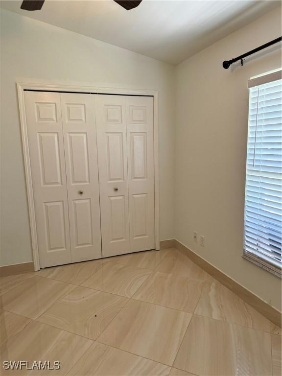 unfurnished bedroom with a closet