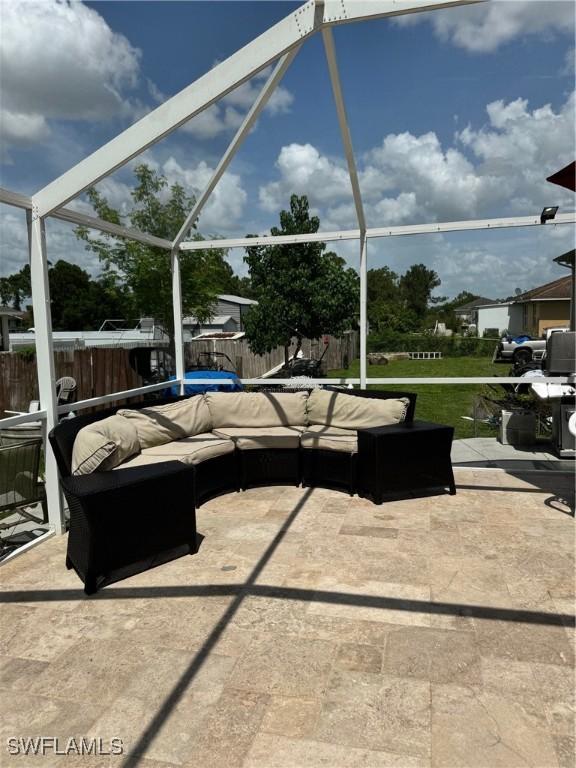 view of patio with a lanai and outdoor lounge area