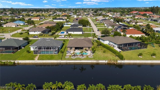 aerial view featuring a water view and a residential view