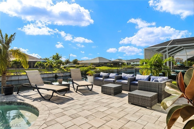 view of patio / terrace featuring glass enclosure and outdoor lounge area