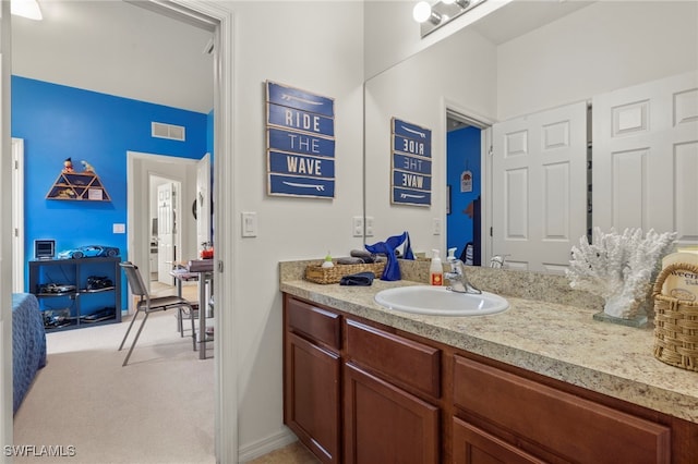 bathroom with vanity and visible vents