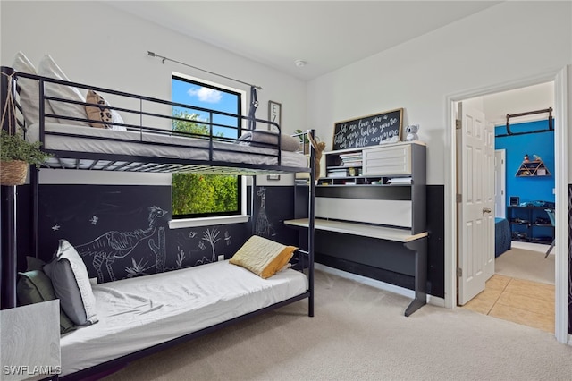 carpeted bedroom with tile patterned floors