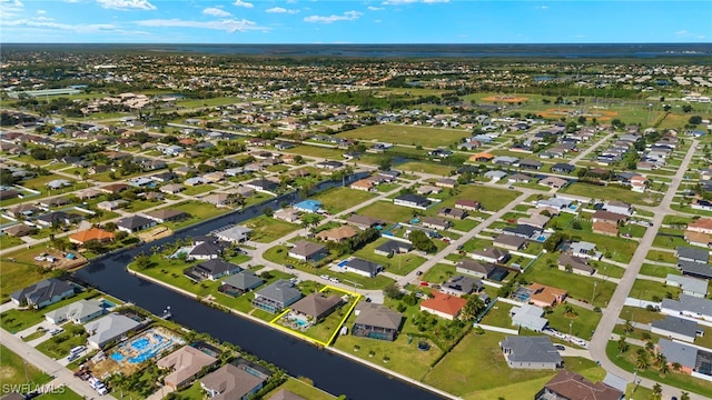 bird's eye view featuring a residential view and a water view