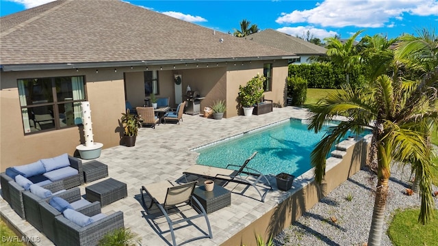 view of pool featuring a fenced in pool, a patio area, grilling area, and an outdoor hangout area