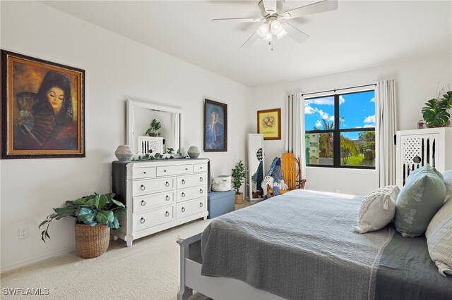 bedroom featuring ceiling fan, carpet, and baseboards