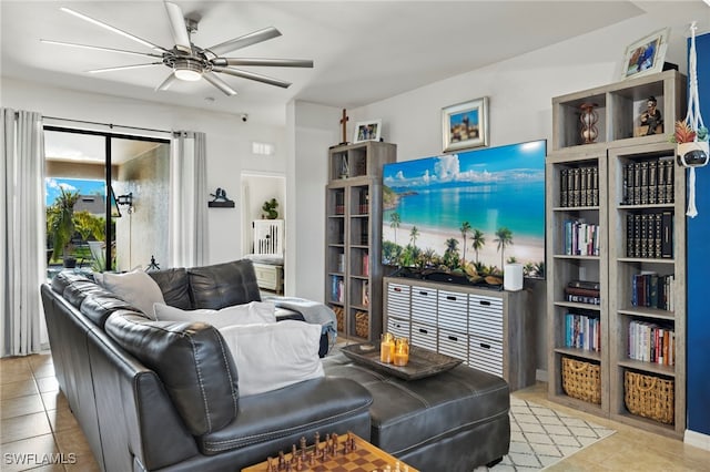 living area featuring ceiling fan and light tile patterned flooring