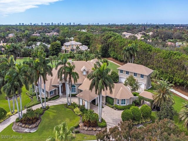 2835 Silverleaf Ln, Naples, FL 34105 - view from above of property with city skyline and a tree filled landscape