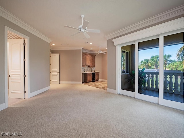 unfurnished living room featuring crown molding, light carpet, and ceiling fan