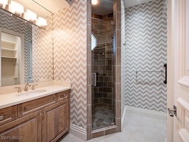 2835 Silverleaf Ln, Naples, FL 34105 - bathroom featuring vanity, wallpapered walls, and a stall shower