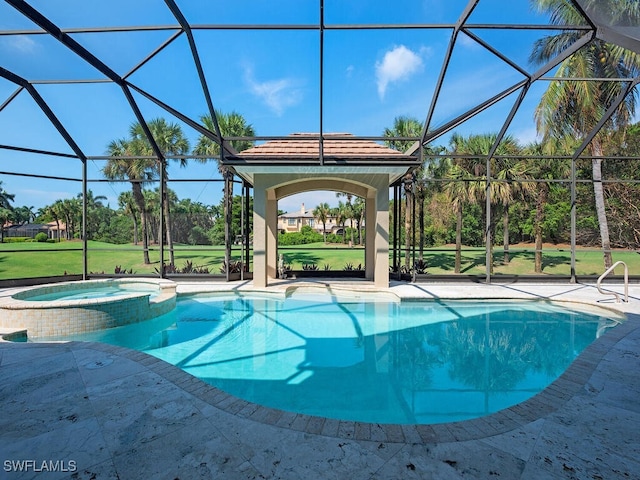 view of swimming pool with an in ground hot tub, glass enclosure, and a yard