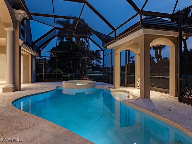 view of pool with a patio area, a lanai, and an in ground hot tub