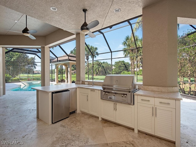 2835 Silverleaf Ln, Naples, FL 34105 - view of patio with exterior kitchen, a ceiling fan, and glass enclosure