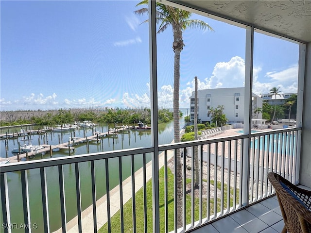 unfurnished sunroom with a water view