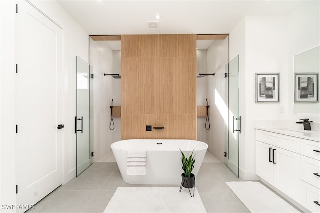 bathroom featuring vanity and separate shower and tub