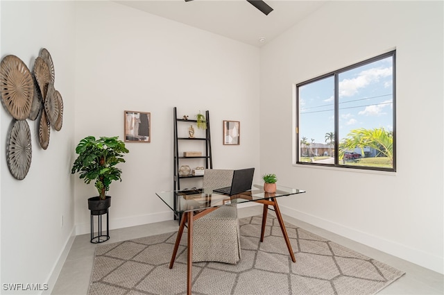 home office with concrete flooring