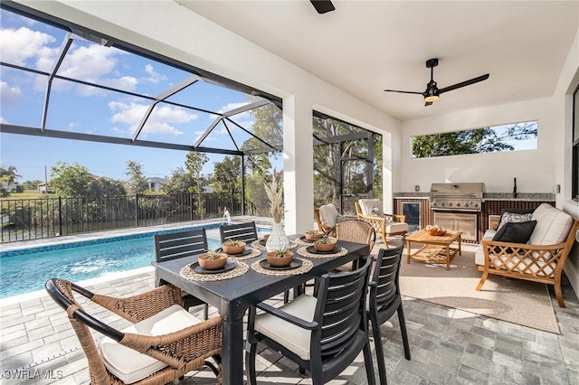 sunroom / solarium featuring ceiling fan