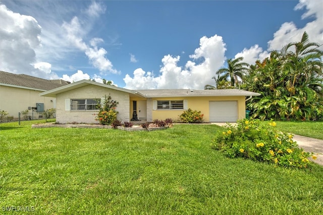 single story home with a front lawn and a garage