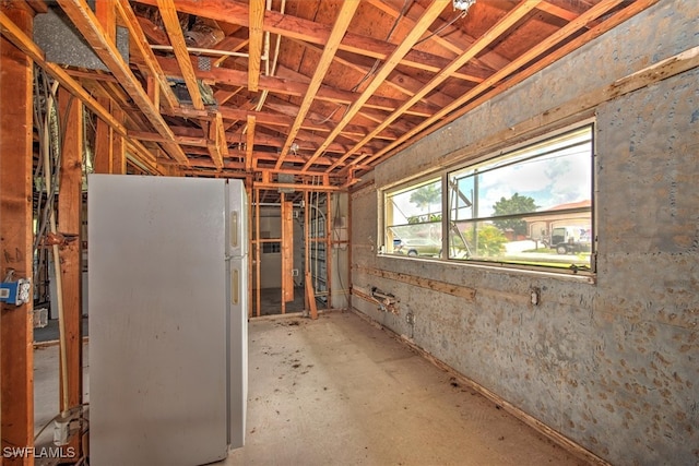 basement featuring white refrigerator