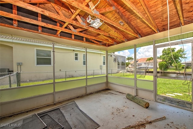 unfurnished sunroom with vaulted ceiling