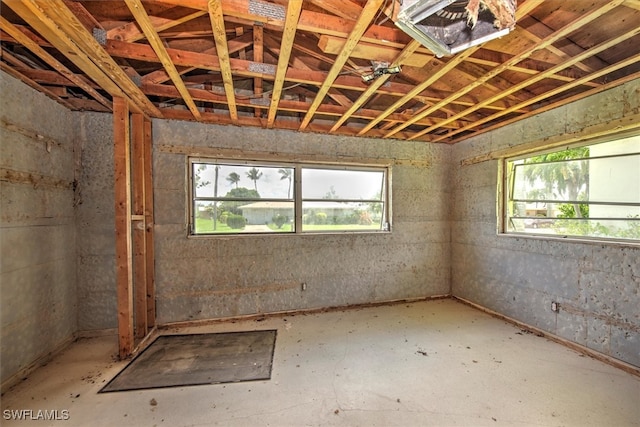 misc room with a wealth of natural light and concrete flooring