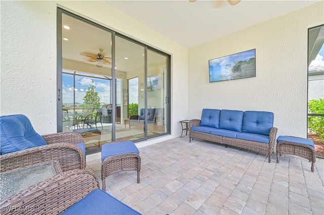 view of patio / terrace with ceiling fan and an outdoor hangout area