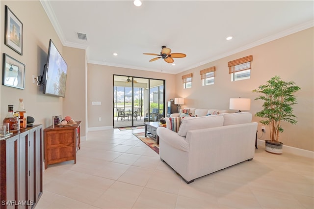 living room with light tile patterned flooring, crown molding, and ceiling fan