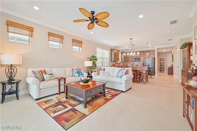 living room featuring ornamental molding, light tile patterned floors, and ceiling fan