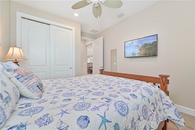 carpeted bedroom with a closet and ceiling fan