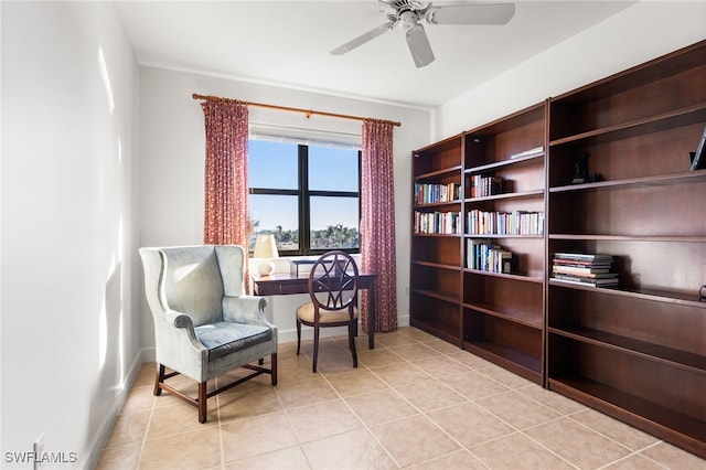 sitting room featuring light tile patterned floors and ceiling fan