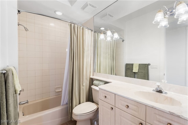 bathroom featuring toilet, visible vents, shower / tub combo with curtain, and vanity