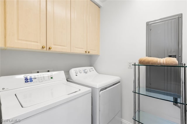 laundry area featuring cabinets and separate washer and dryer